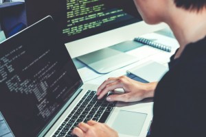 Developing programmer Development Website design and coding technologies working in software company office